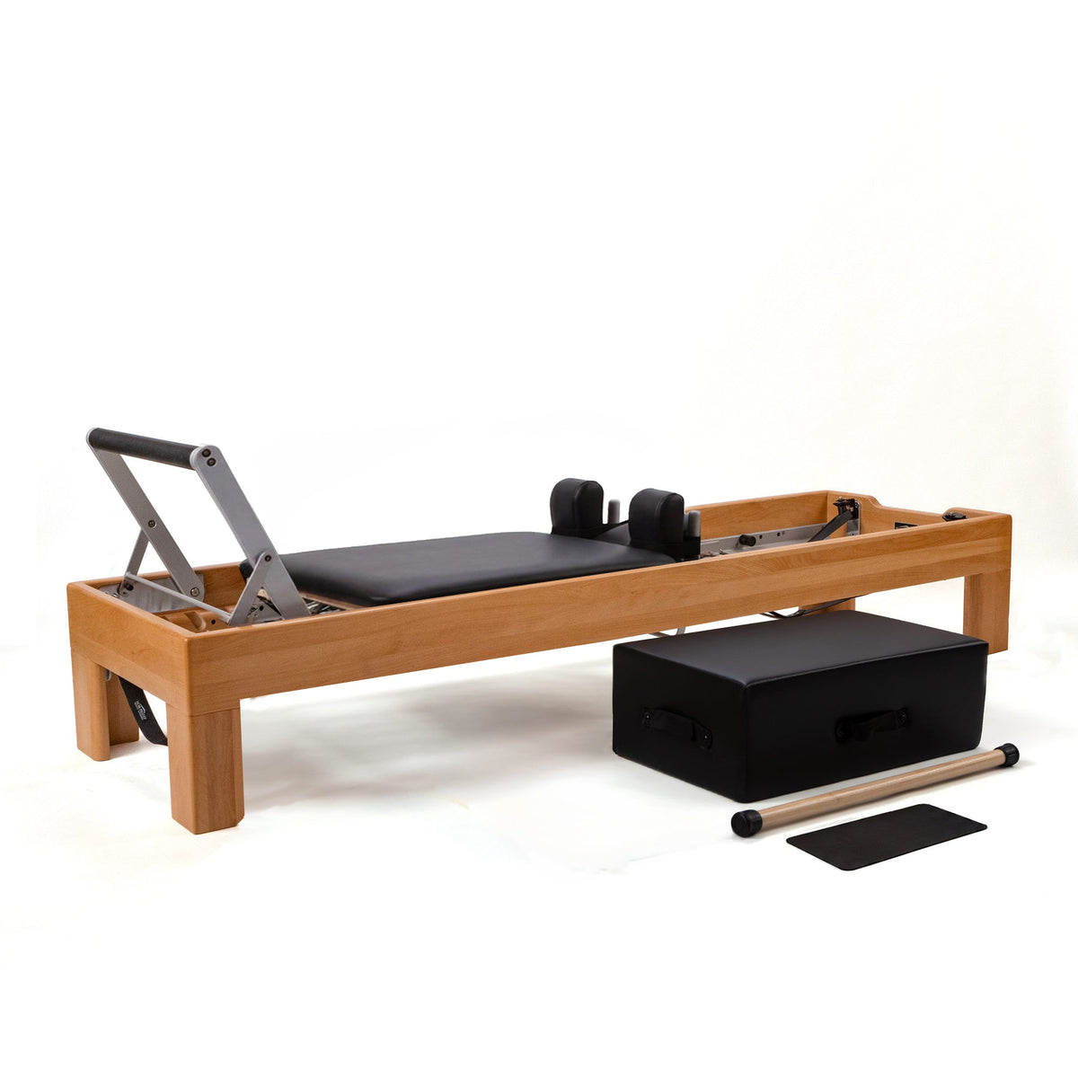 Peak Pilates Artistry Reformer with Vegan Straps in beechwood, shown with the long/short box, short box bar and mat