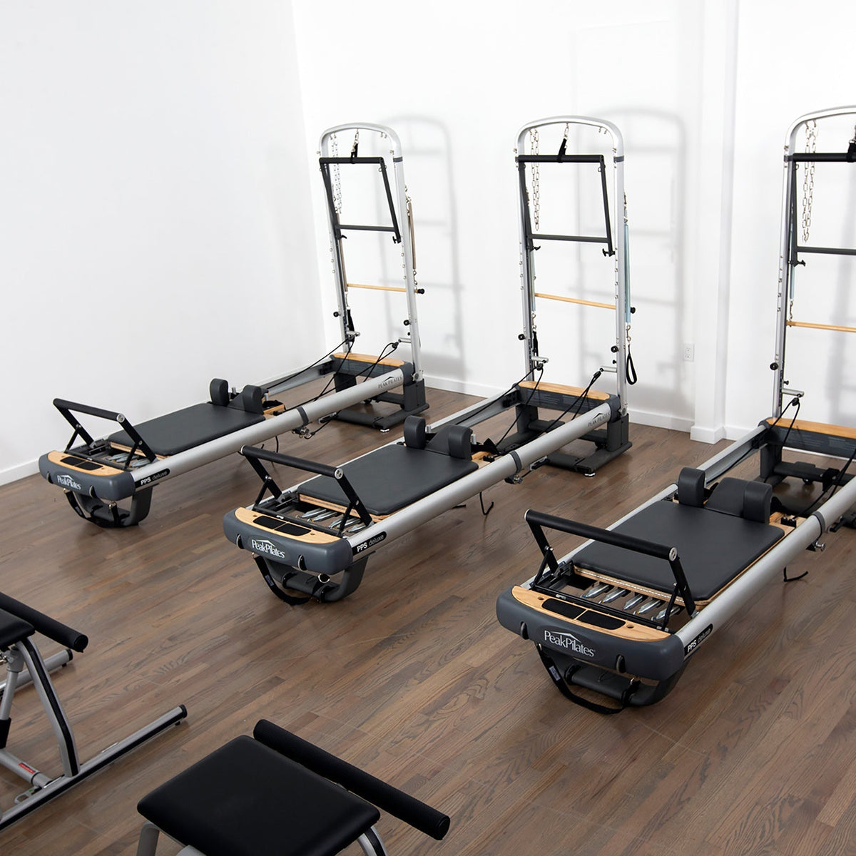 Peak Pilates PilateSystem Deluxe Bundle, an anodized aluminium reformer with tower that folds and rolls for storage