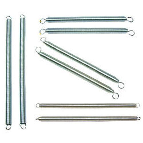 Eight Cadillac springs for arm, leg, push-through and trapeze positions laid out together