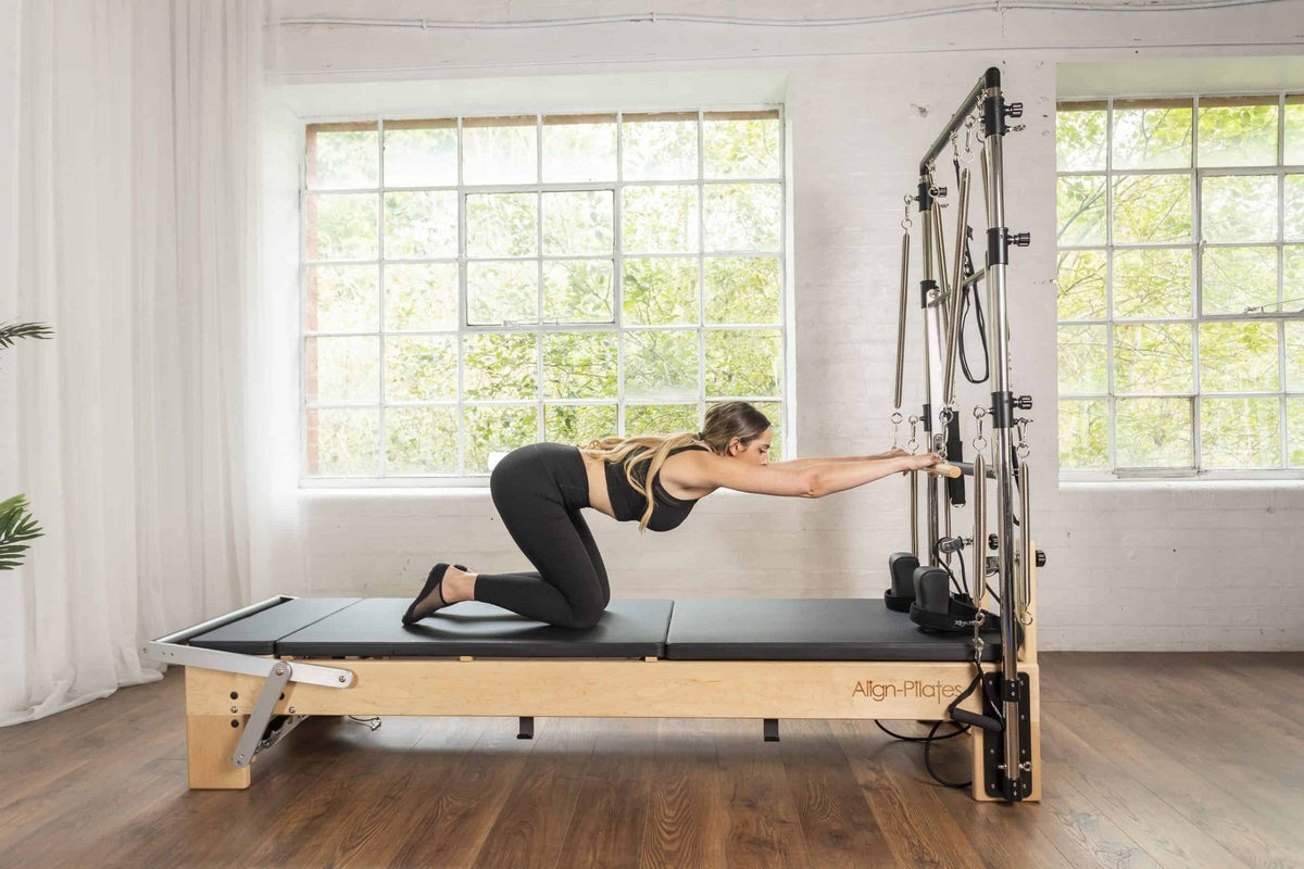 Align Pilates M8-Pro with Half Cadillac, kneeling exercise on the carriage