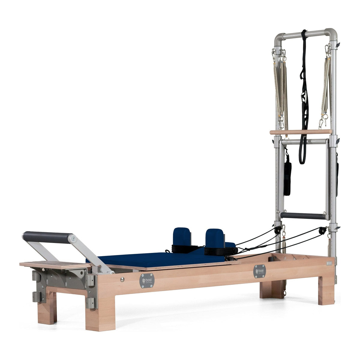 BASI Systems Compact Reformer with Tower upholstered in Dark Navy, the whole apparatus shown against a plain background