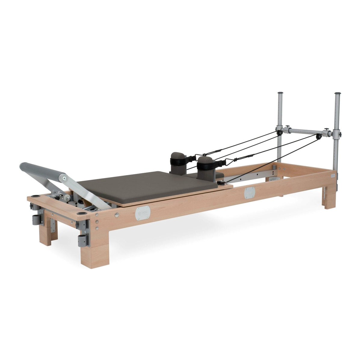 BASI Systems Reformer upholstered in Dark Cool Sand, the whole apparatus shown against a plain background