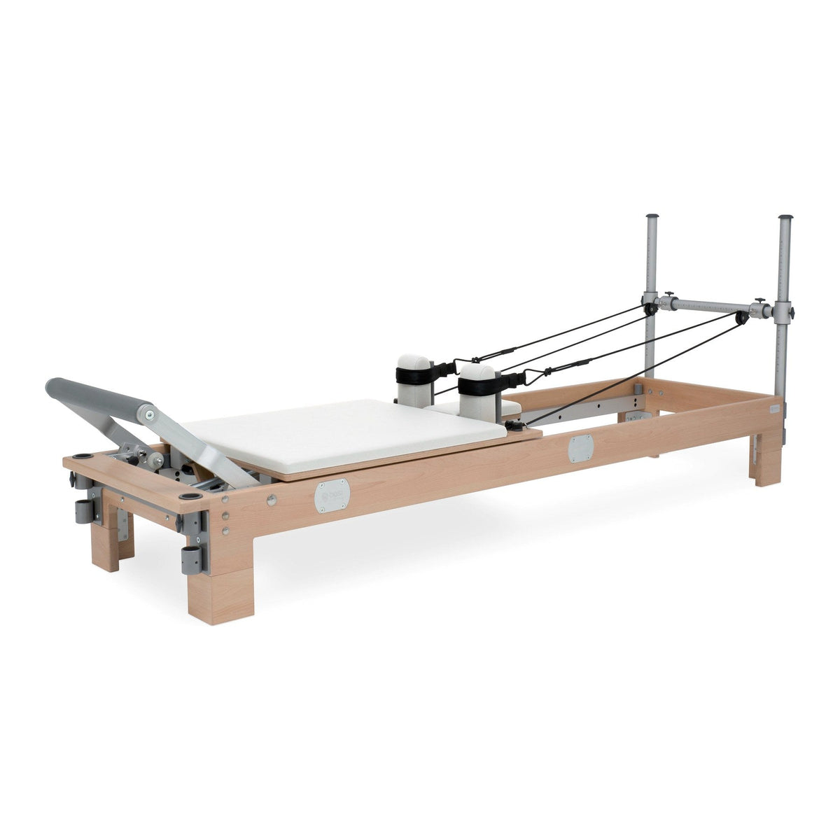 BASI Systems Reformer upholstered in Pristine White, the whole apparatus shown against a plain background
