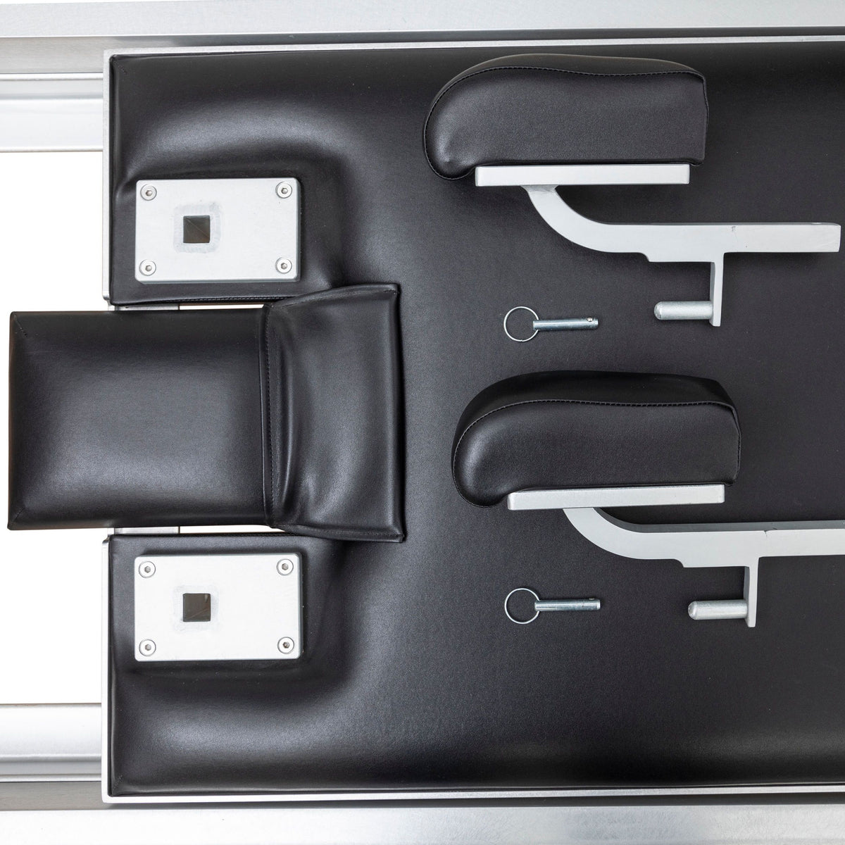 Headrest, shoulder rests, footbar brackets and locking pins from above, black