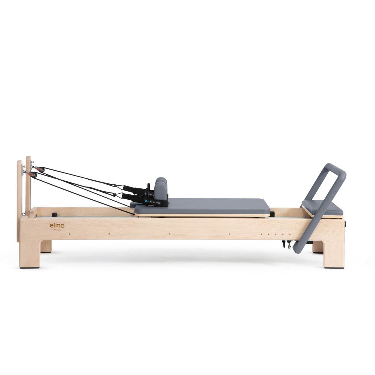 Elite Advanced Reformer side view, grey, straps stretched to the risers