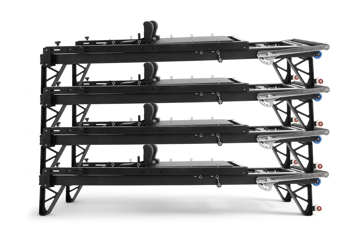 Four Elina Pilates HL aluminium reformers stacked horizontally, front angle