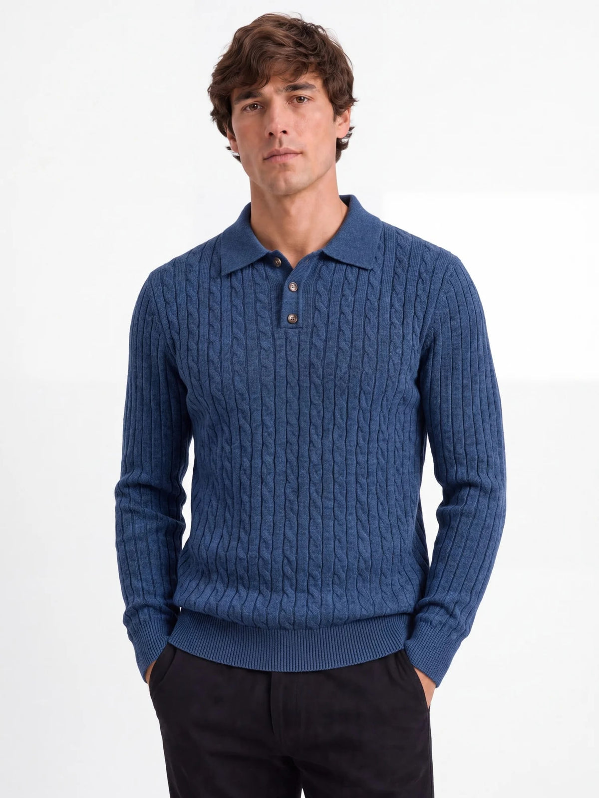 Man wearing the Calder cable-knit polo sweater in blue