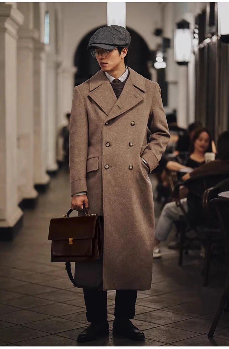 Man wearing the Hartley polo coat in camel indoors