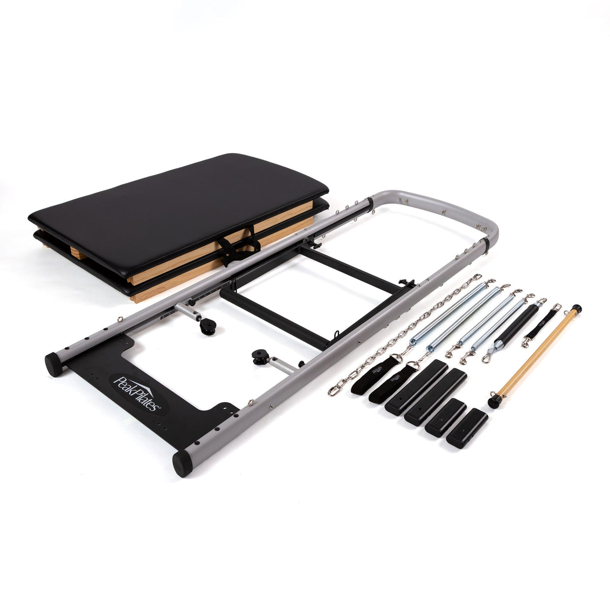 Peak Pilates MVe Reformer Tower Conversion kit contents laid out: aluminum frame, twin mats, springs, bars and foot loops