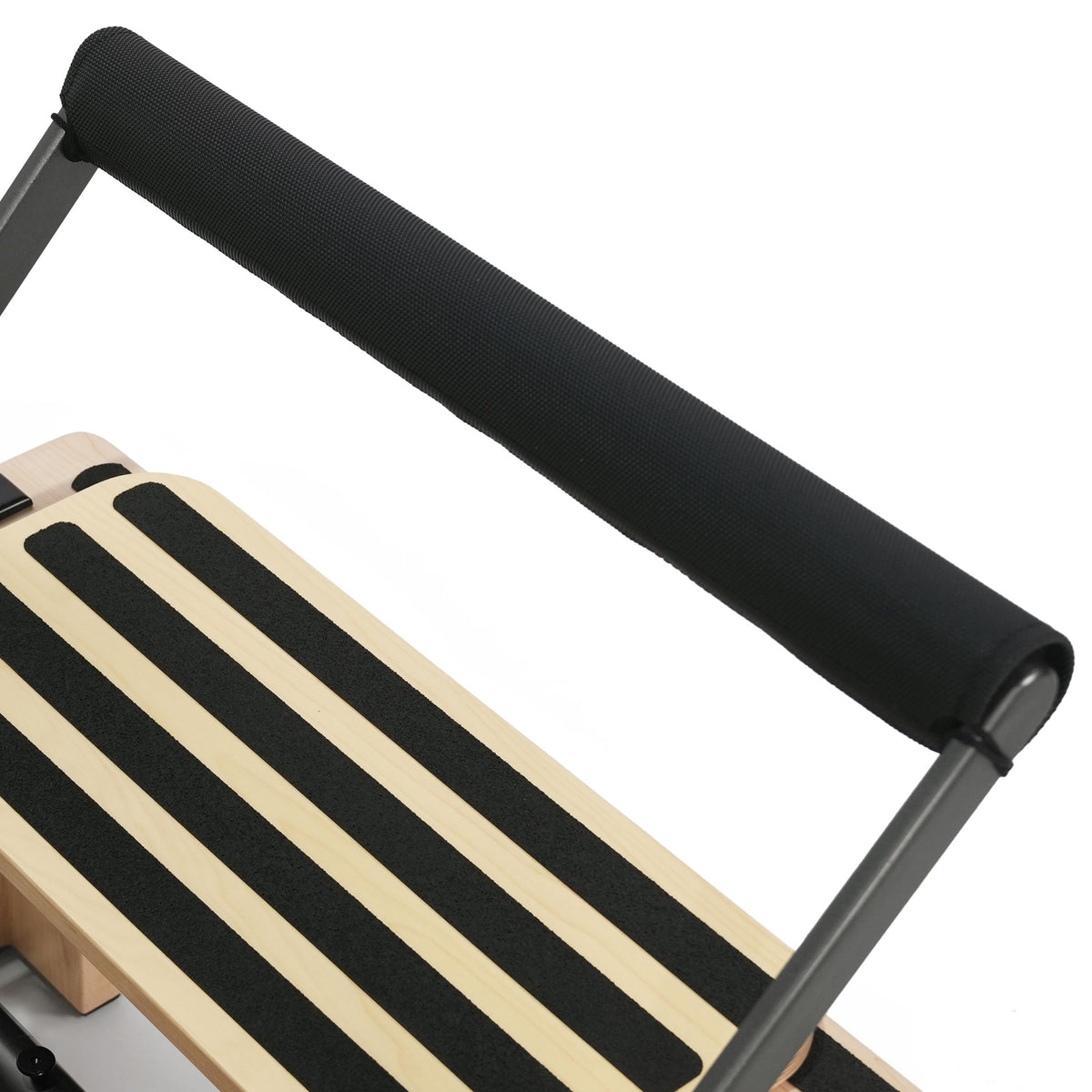 Club Reformer padded footbar roller and grip-strip standing platform detail