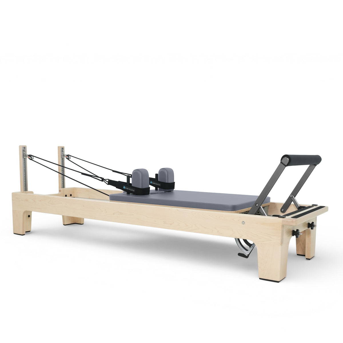Elina Pilates Club Reformer in maple with wooden rope risers, grey upholstery, angled studio view