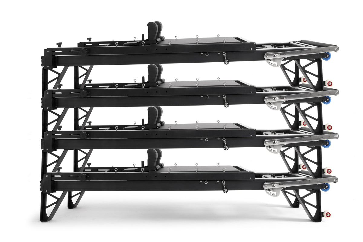 Four black Elina Pilates HL aluminium reformers stacked horizontally, from the HL 2 Aluminium Reformer Bundle