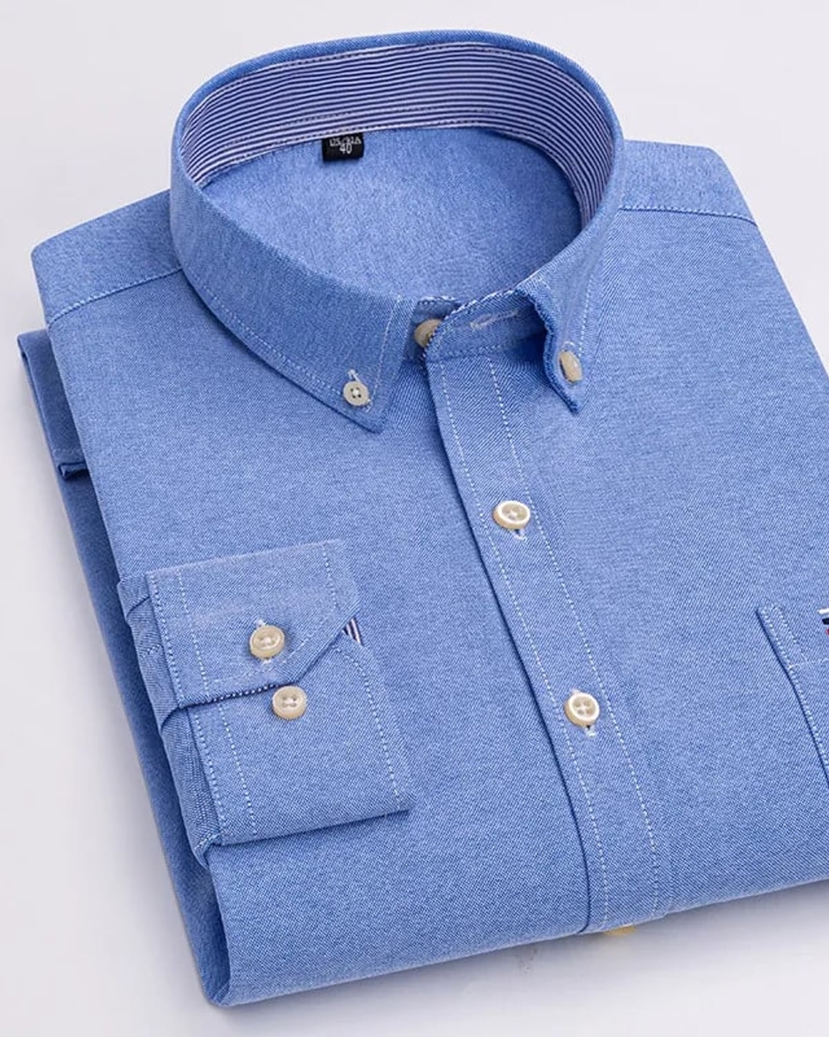 Folded blue oxford button-down shirt
