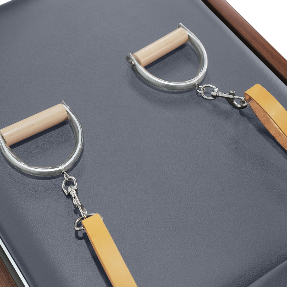 D-ring handles with wooden grips and tan leather straps, grey pad, walnut frame