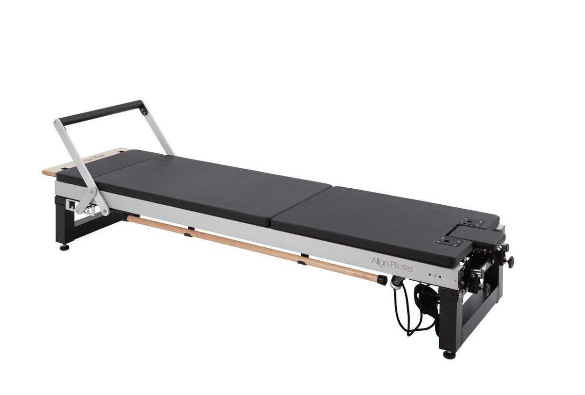 Align Pilates Mat Converter for A Series, fitted to a black reformer on a white background