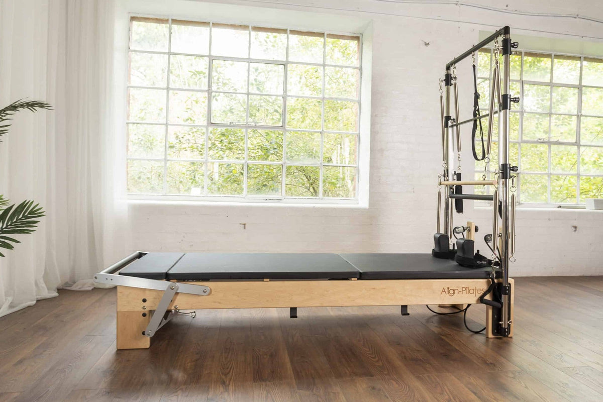 Align Pilates Mat Converter for M Series, side view of the flat bed in a studio
