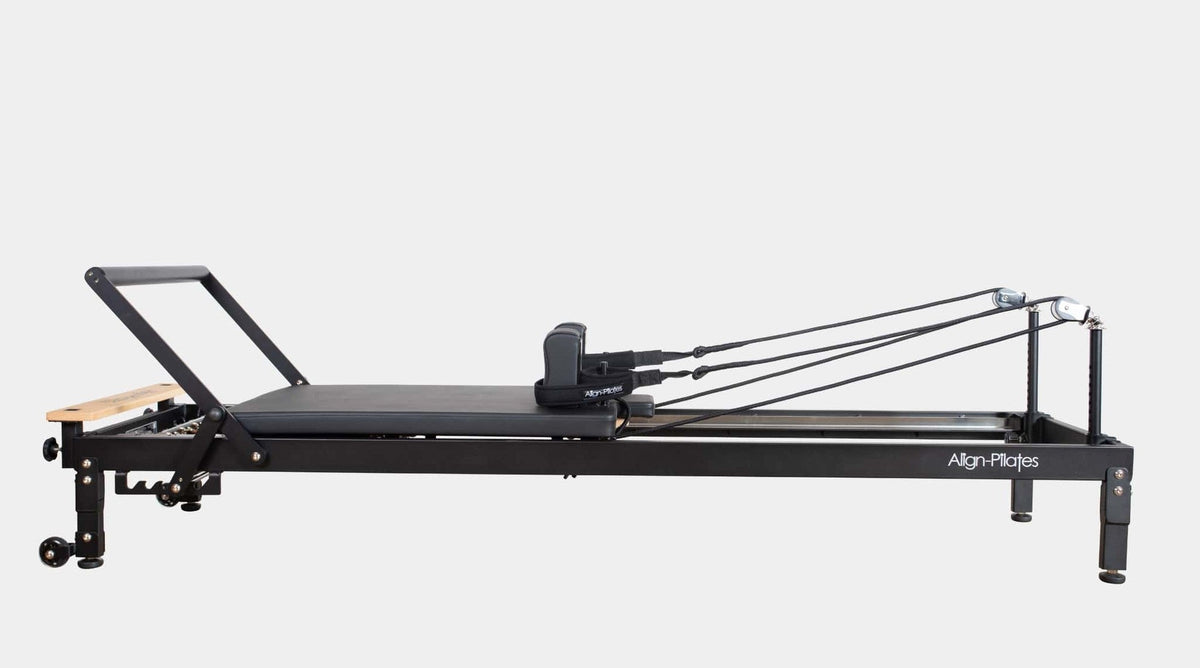 Align Pilates R8-Pro Reformer, black frame profile on a grey background