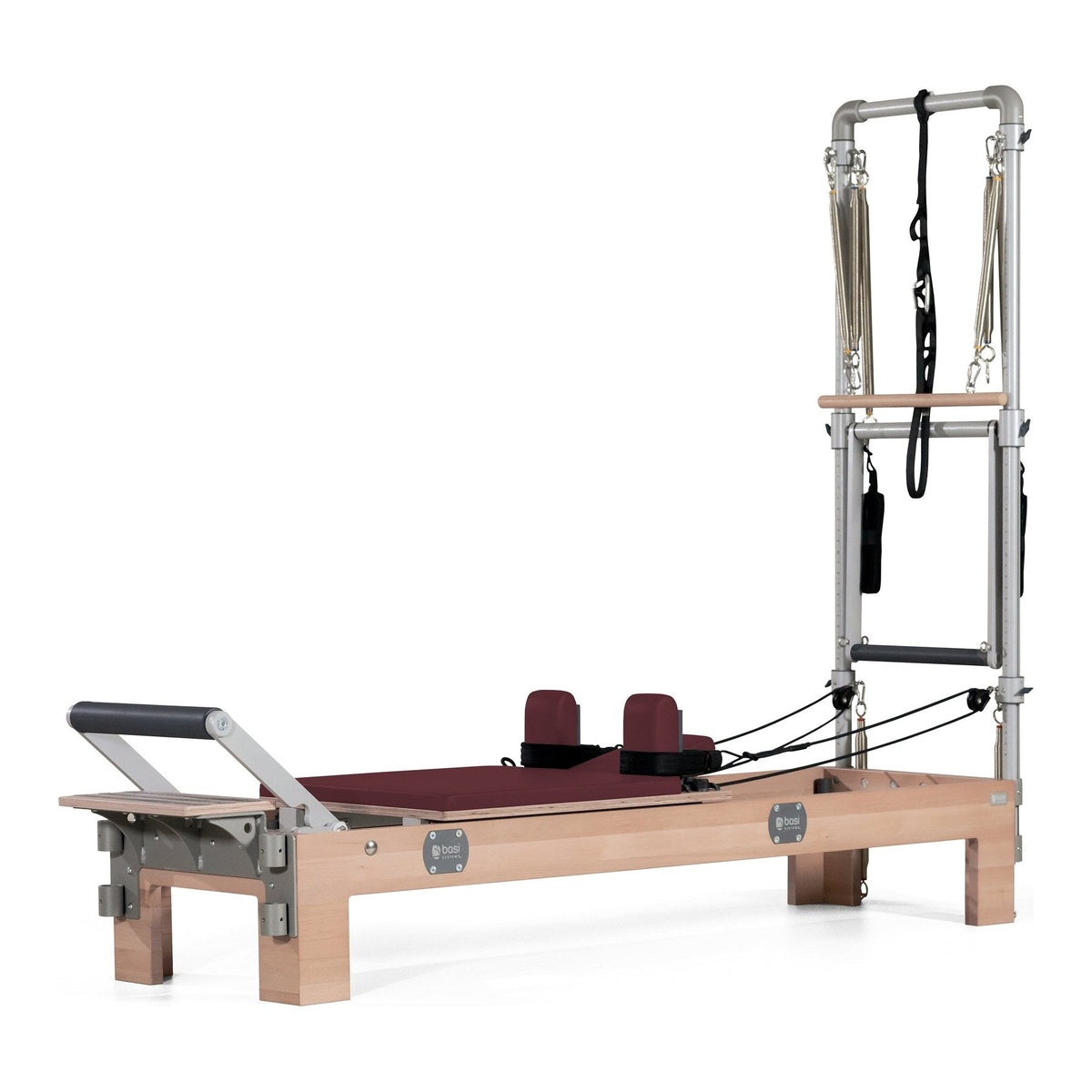 BASI Systems Compact Reformer with Tower upholstered in Burgundy, the whole apparatus shown against a plain background