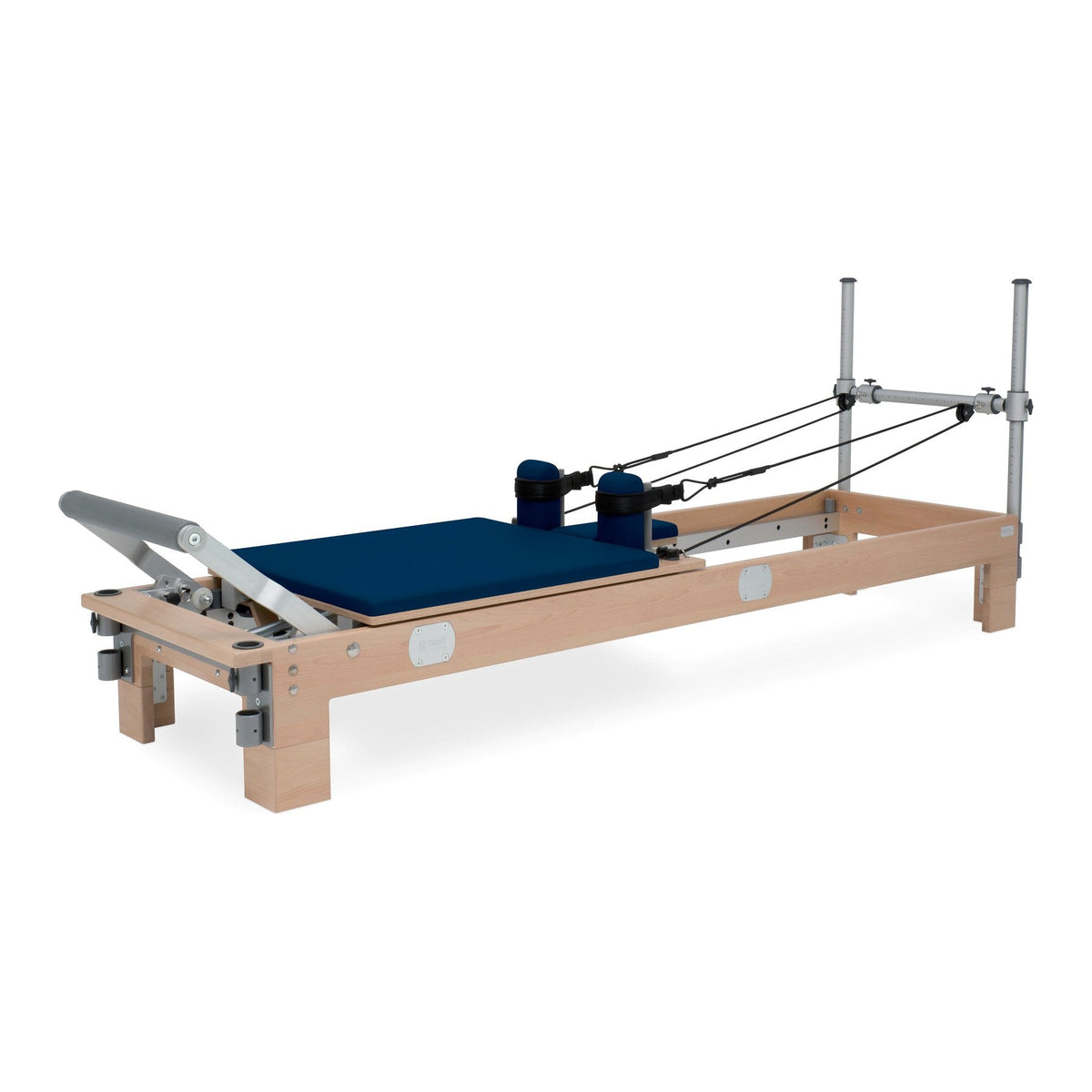 BASI Systems Reformer upholstered in Dark Navy, the whole apparatus shown against a plain background
