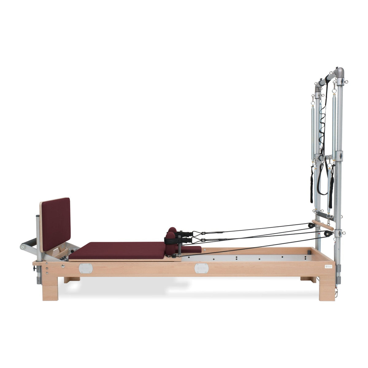 BASI Systems Reformer with Tower upholstered in Burgundy, the whole apparatus shown against a plain background, third view