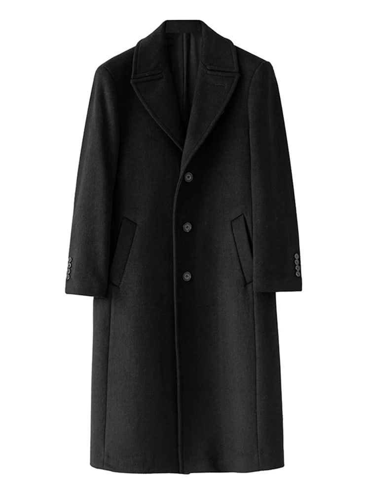 Ashford black overcoat laid flat on a white background