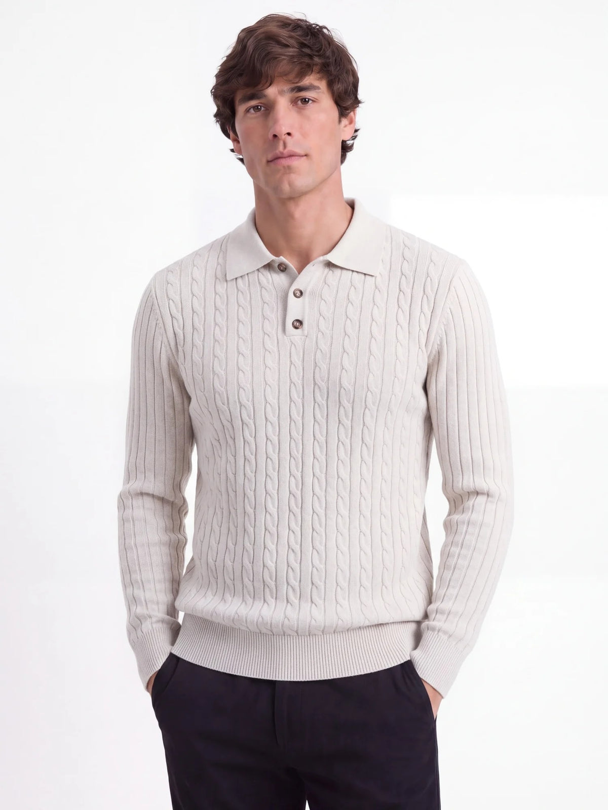 Calder cable-knit polo sweater in cream on a model