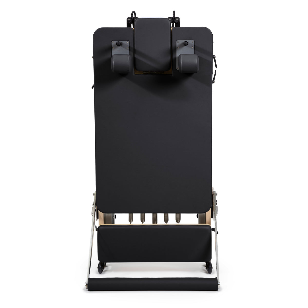 Rear view of the folded Fold Reformer standing upright, black