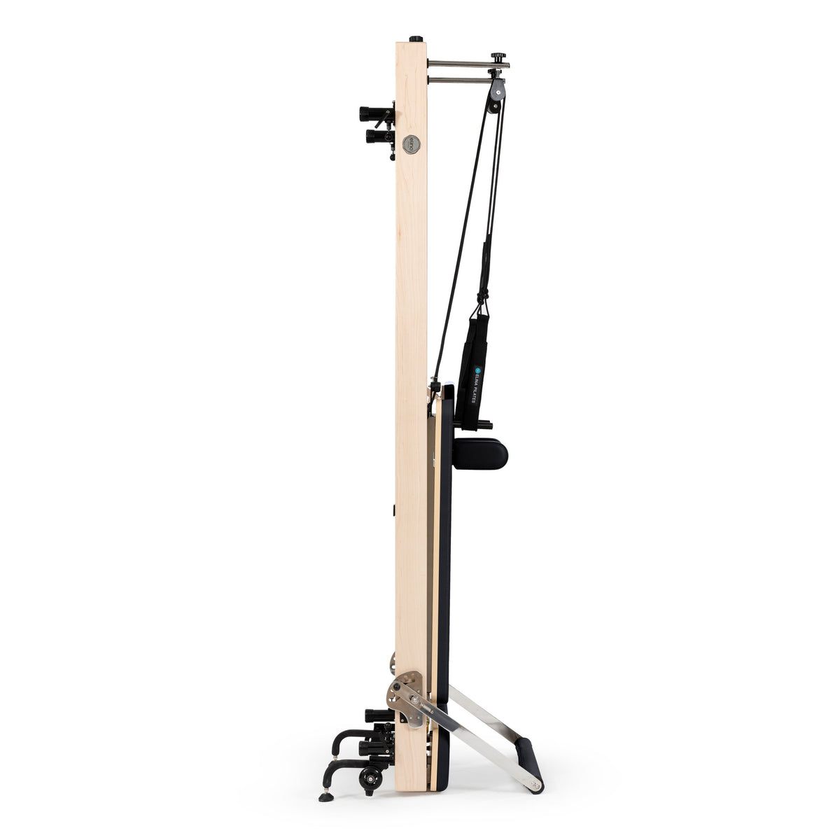 Elina Pilates Vertical Reformer stored upright on its wooden column, black - the vertical storage position