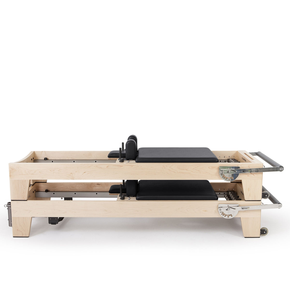 Two Elina Pilates Elite Wood Reformers stacked, black, side view