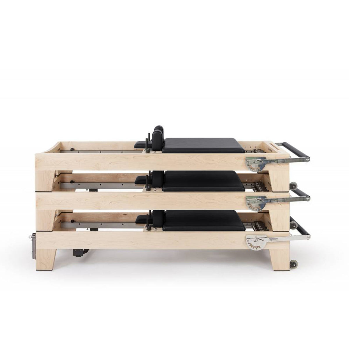 Three Elina Pilates Elite Wood Reformers stacked, black upholstery